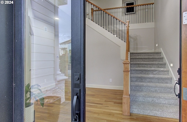 stairway featuring hardwood / wood-style floors