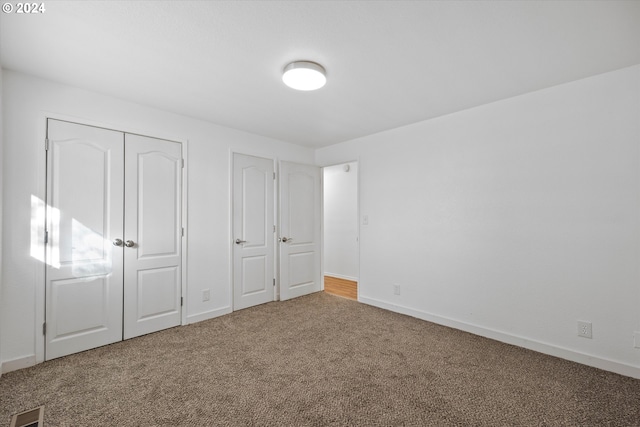 unfurnished bedroom featuring carpet floors