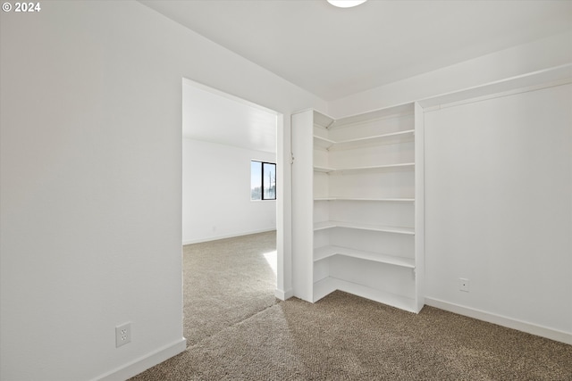 empty room with carpet flooring