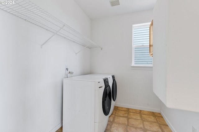 laundry room featuring washing machine and dryer