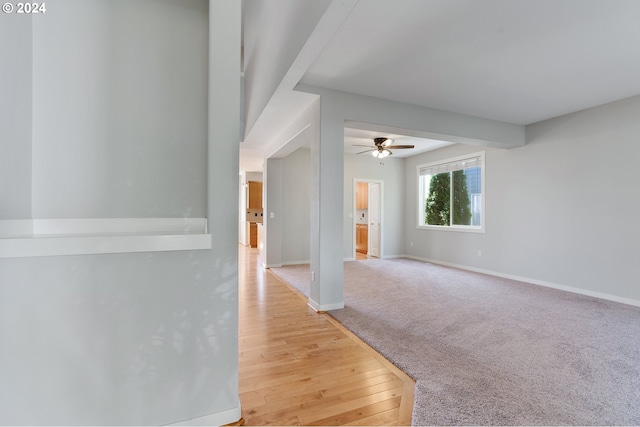 empty room featuring hardwood / wood-style flooring and ceiling fan