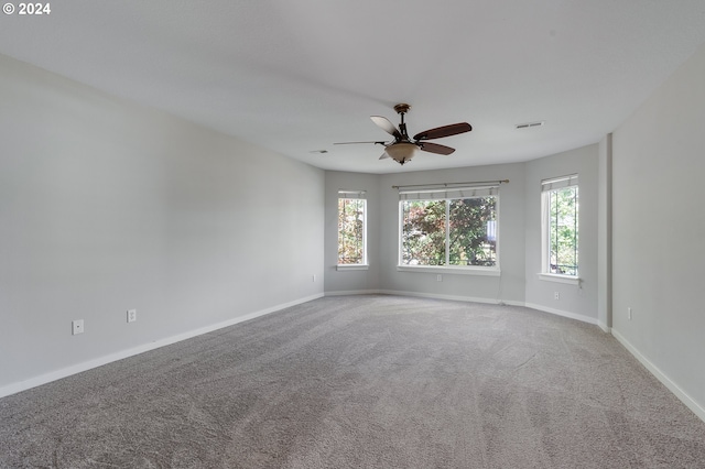 unfurnished room featuring carpet and ceiling fan