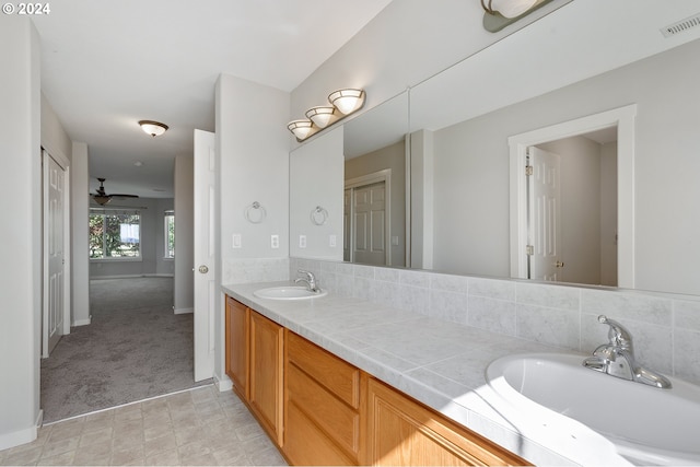 bathroom featuring vanity and ceiling fan