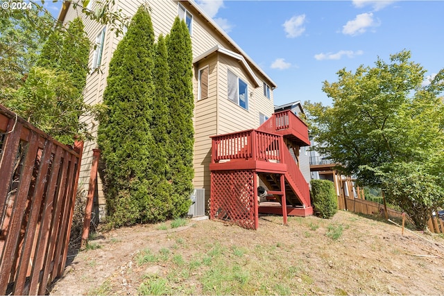 exterior space with central air condition unit and a deck