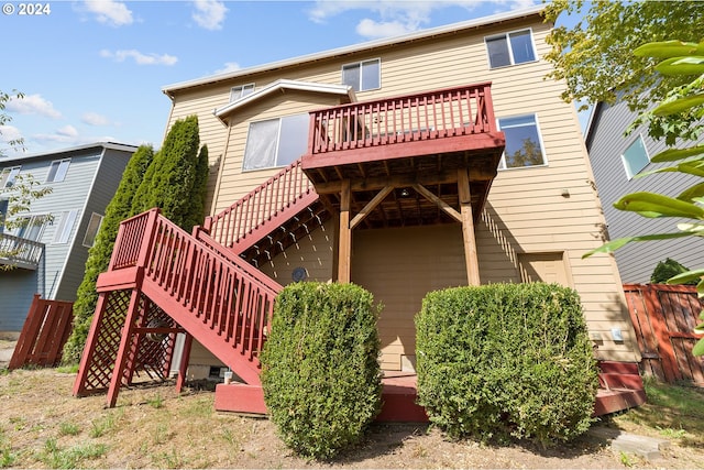 back of property with a wooden deck