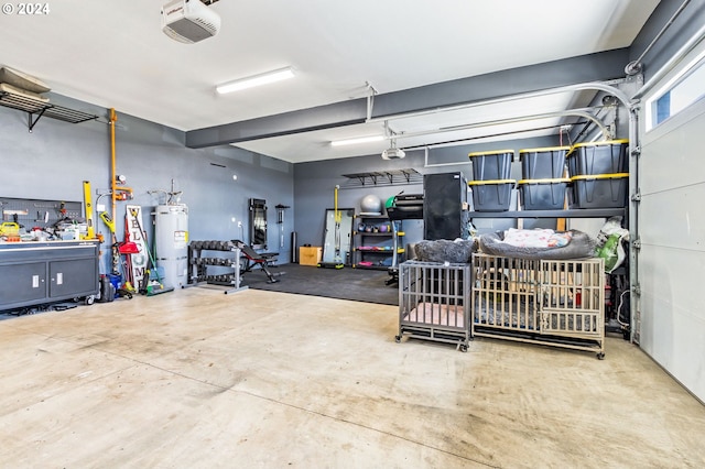 garage featuring a workshop area, secured water heater, and a garage door opener