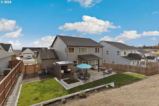 rear view of property featuring central AC unit and a patio area