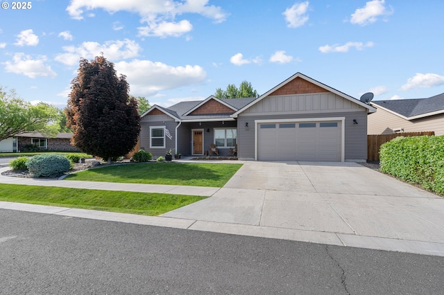 view of front of property featuring a garage and a front yard