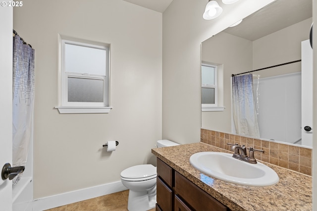 full bathroom with vanity, baseboards, tile patterned flooring, toilet, and tasteful backsplash