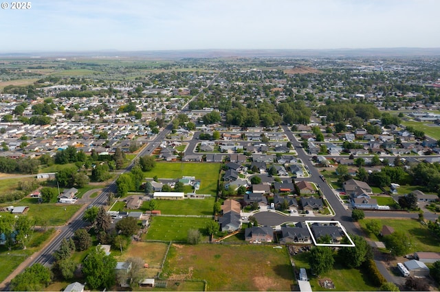 birds eye view of property with a residential view