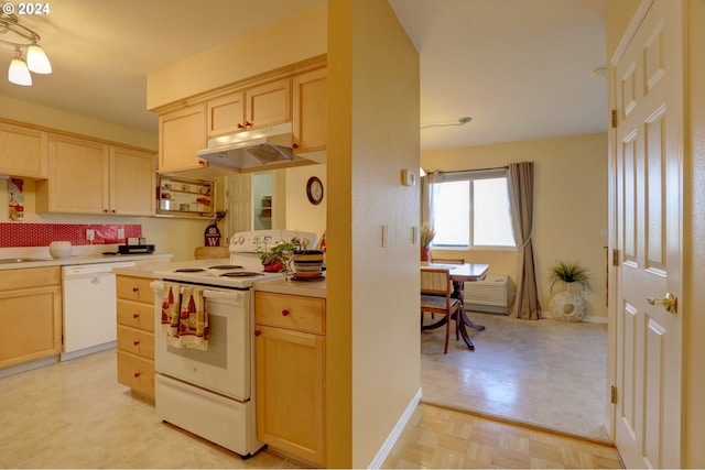 kitchen featuring light brown cabinetry, white appliances, and light parquet flooring