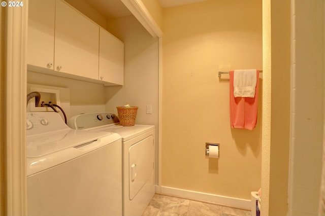 laundry area with cabinets and independent washer and dryer