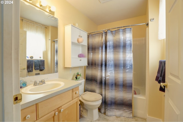 full bathroom with shower / bath combo, toilet, and vanity