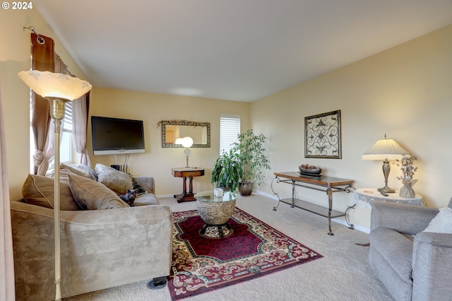 carpeted living room featuring plenty of natural light