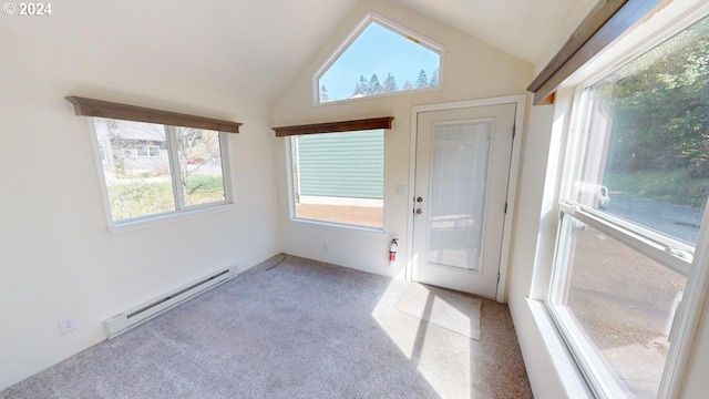 interior space featuring a baseboard heating unit and lofted ceiling