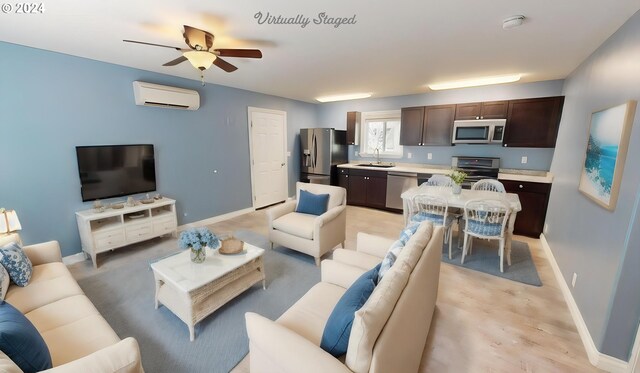 living room with sink, ceiling fan, and a wall unit AC