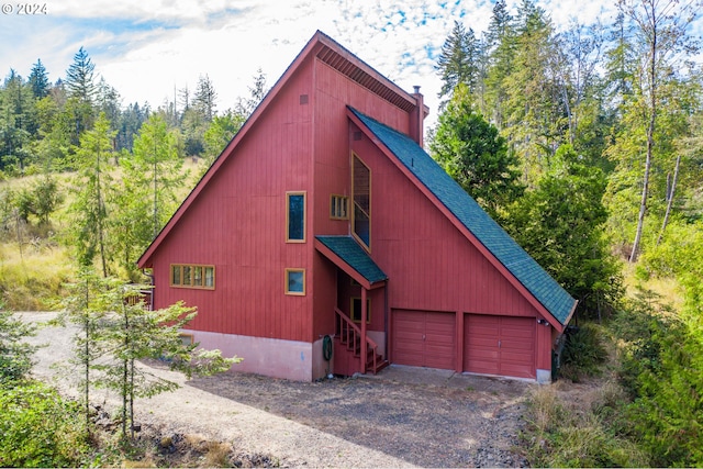 view of side of home with a garage