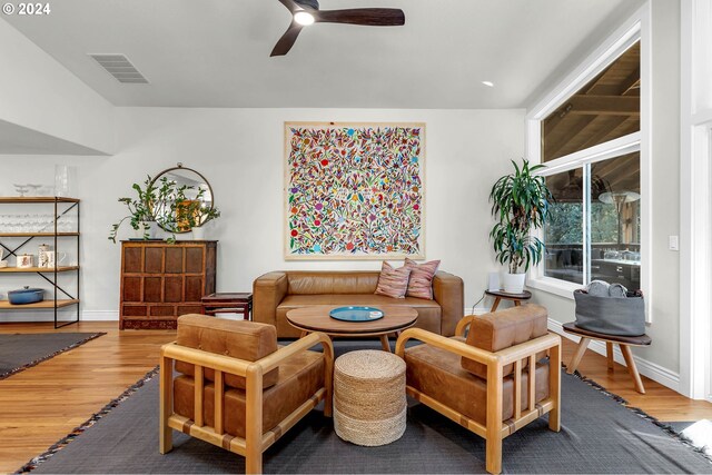 living room with ceiling fan and wood-type flooring