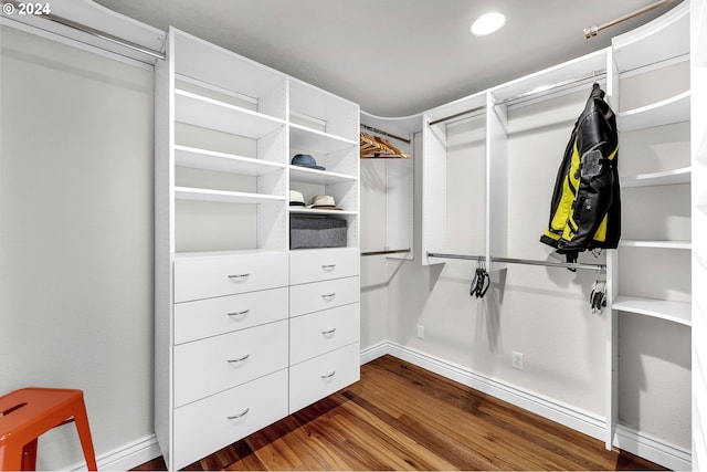 walk in closet featuring dark wood-type flooring