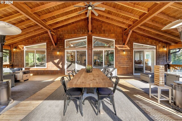 interior space with ceiling fan and a deck