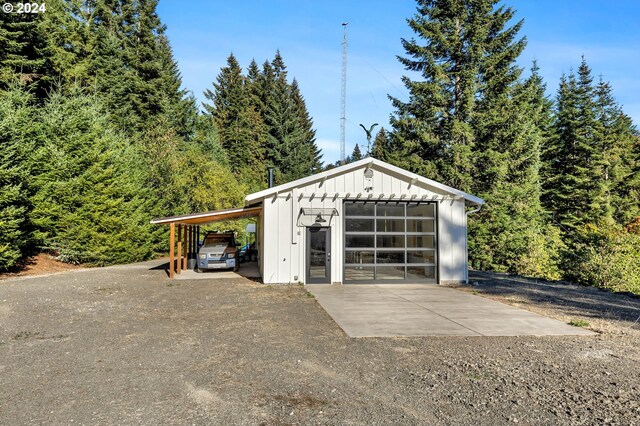 garage featuring a carport