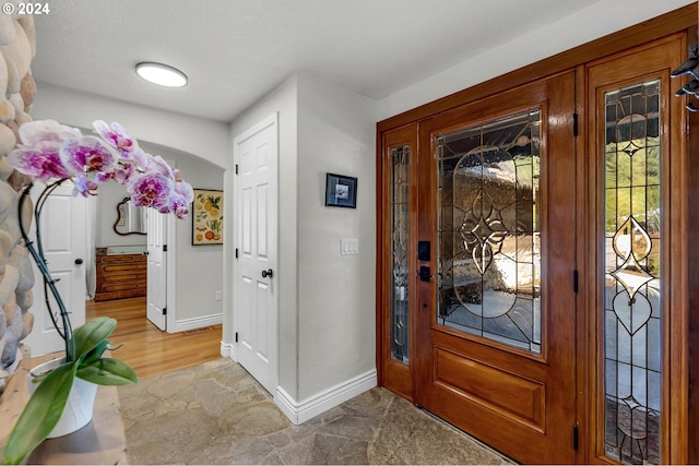 foyer with wood-type flooring