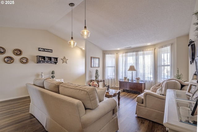 living room with dark hardwood / wood-style flooring, vaulted ceiling, and a textured ceiling