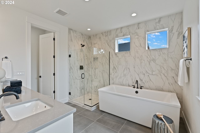 bathroom with vanity, tile patterned floors, and separate shower and tub