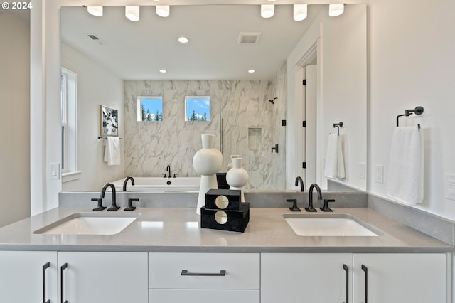 bathroom featuring vanity and plus walk in shower