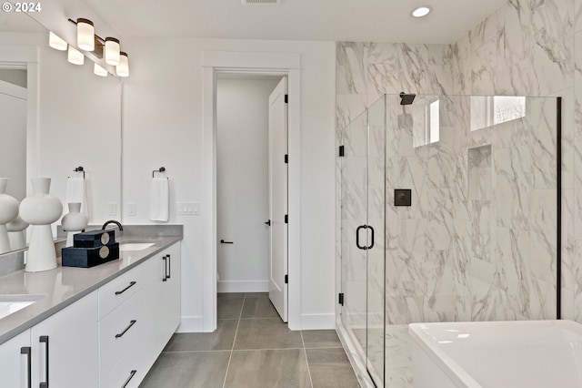 bathroom with tile patterned flooring, an enclosed shower, and vanity