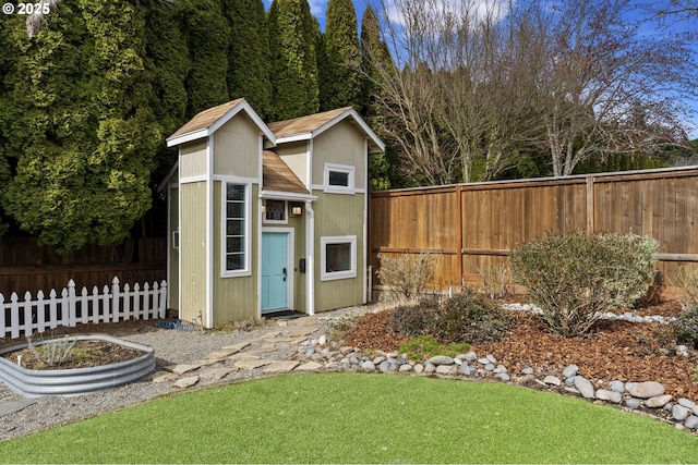 view of shed featuring a fenced backyard