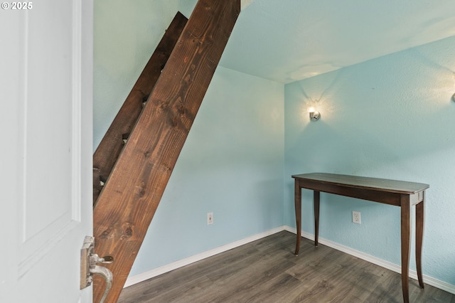 bonus room with wood finished floors and baseboards