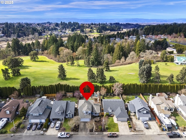 aerial view with view of golf course and a residential view