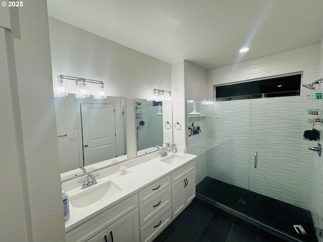 bathroom featuring walk in shower, vanity, and tile patterned flooring