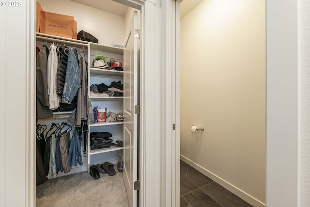 walk in closet featuring carpet floors