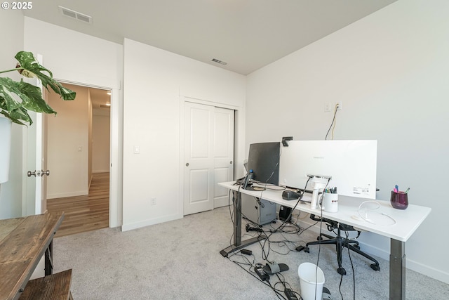 office space with light colored carpet