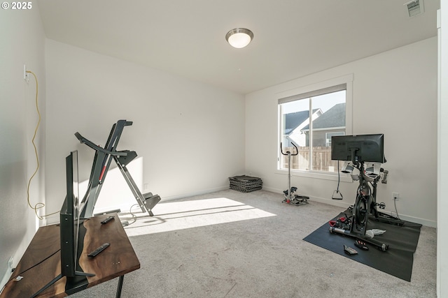 exercise room with carpet flooring