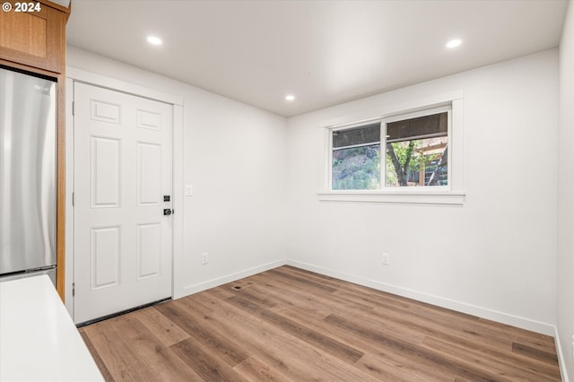 empty room with wood-type flooring