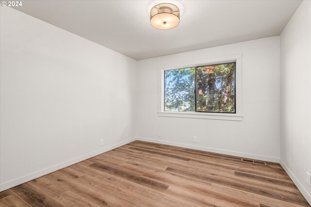 empty room featuring hardwood / wood-style floors