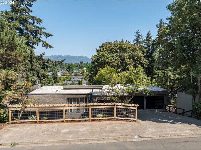 view of front of house with a mountain view and a garage