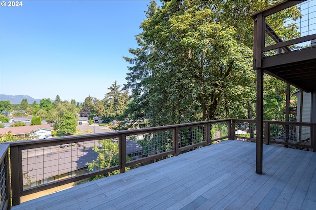 wooden deck with a mountain view