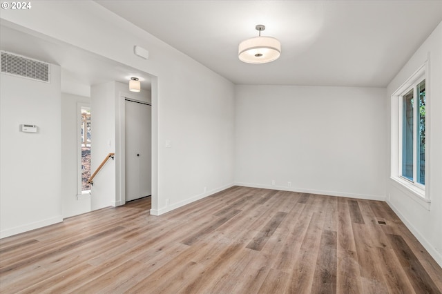 unfurnished room with light hardwood / wood-style flooring