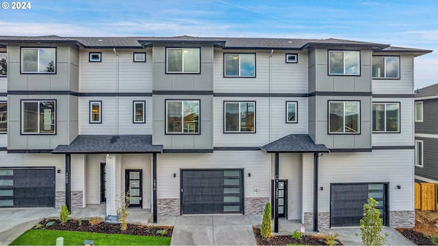 townhome / multi-family property featuring a garage