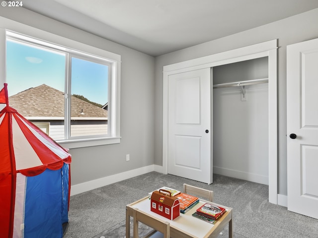interior space with baseboards and carpet