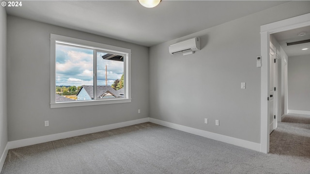 carpeted empty room with a wall mounted AC and baseboards
