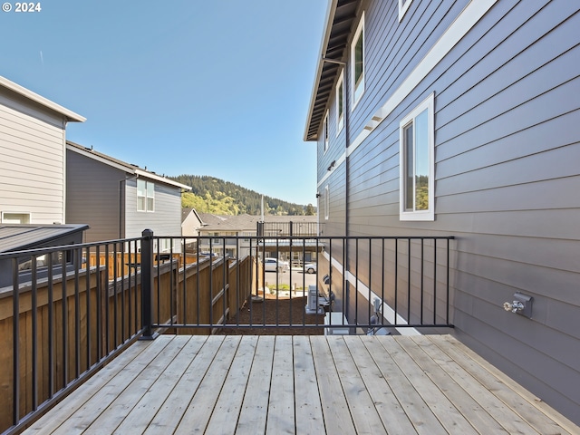 wooden deck featuring a mountain view