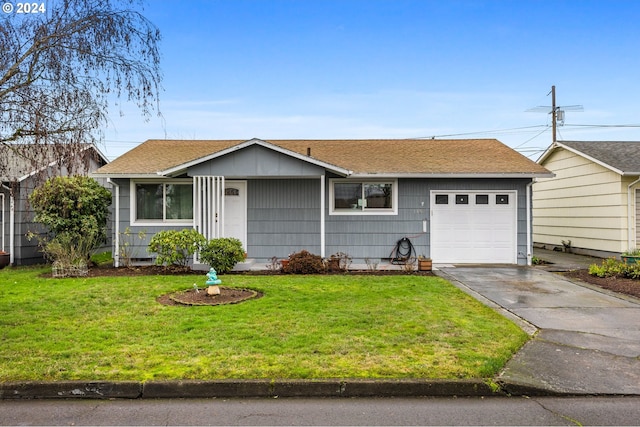 ranch-style home featuring a front lawn and a garage