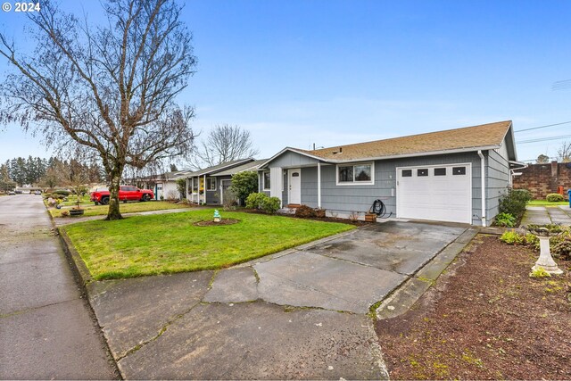 single story home featuring a front yard and a garage