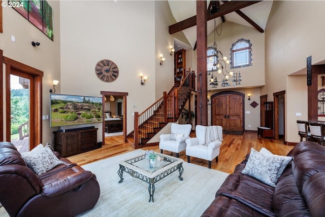 living room featuring beamed ceiling, wood-type flooring, and high vaulted ceiling