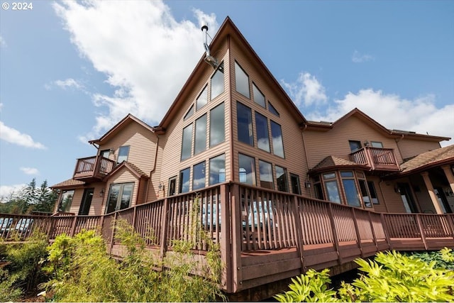 back of house featuring a deck